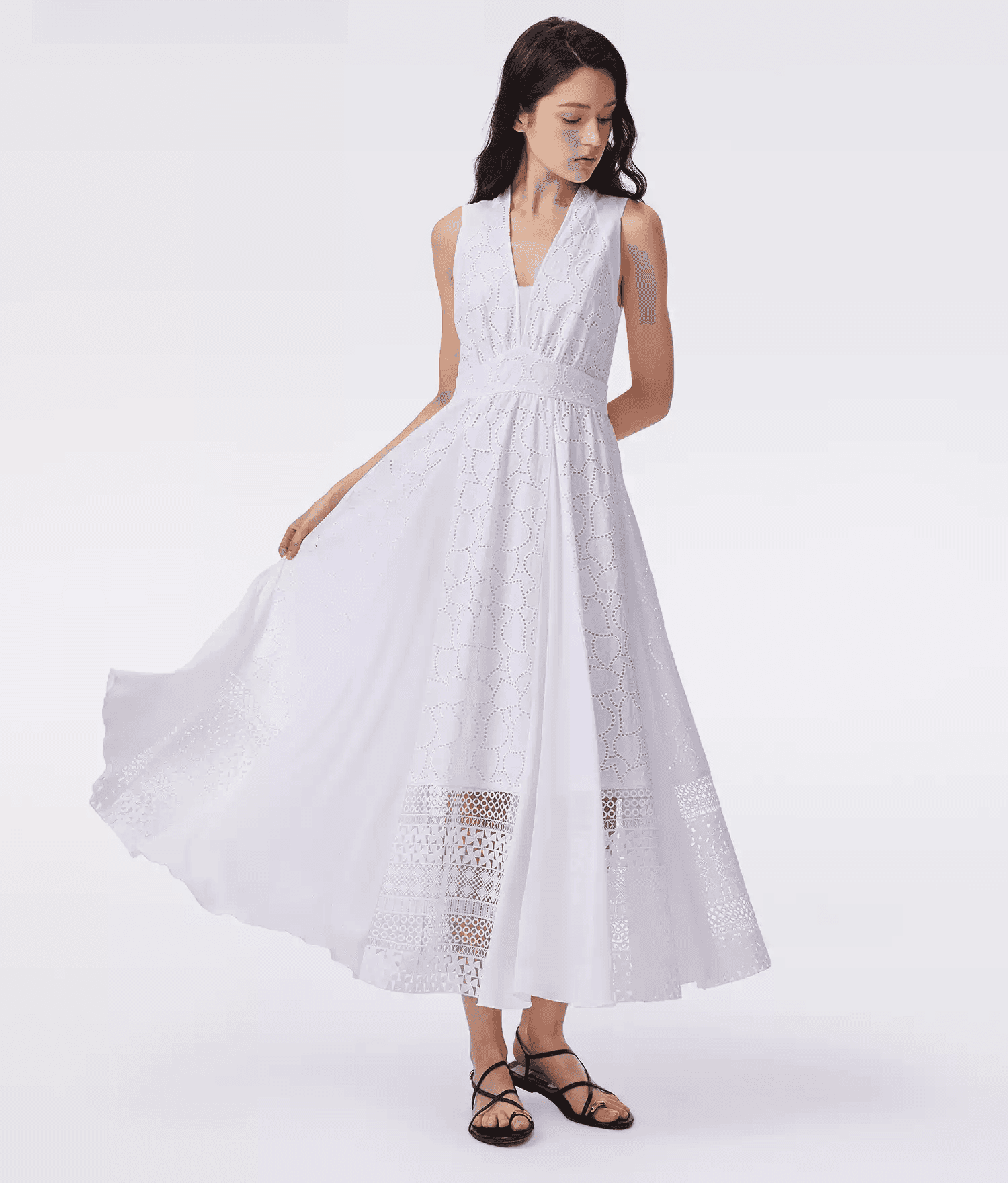 Discover the DVF Fall 2026 sleeveless cotton dress, featuring intricate embroidery, lace panels, a V-neckline and a flattering A-line silhouette. Available in purple.